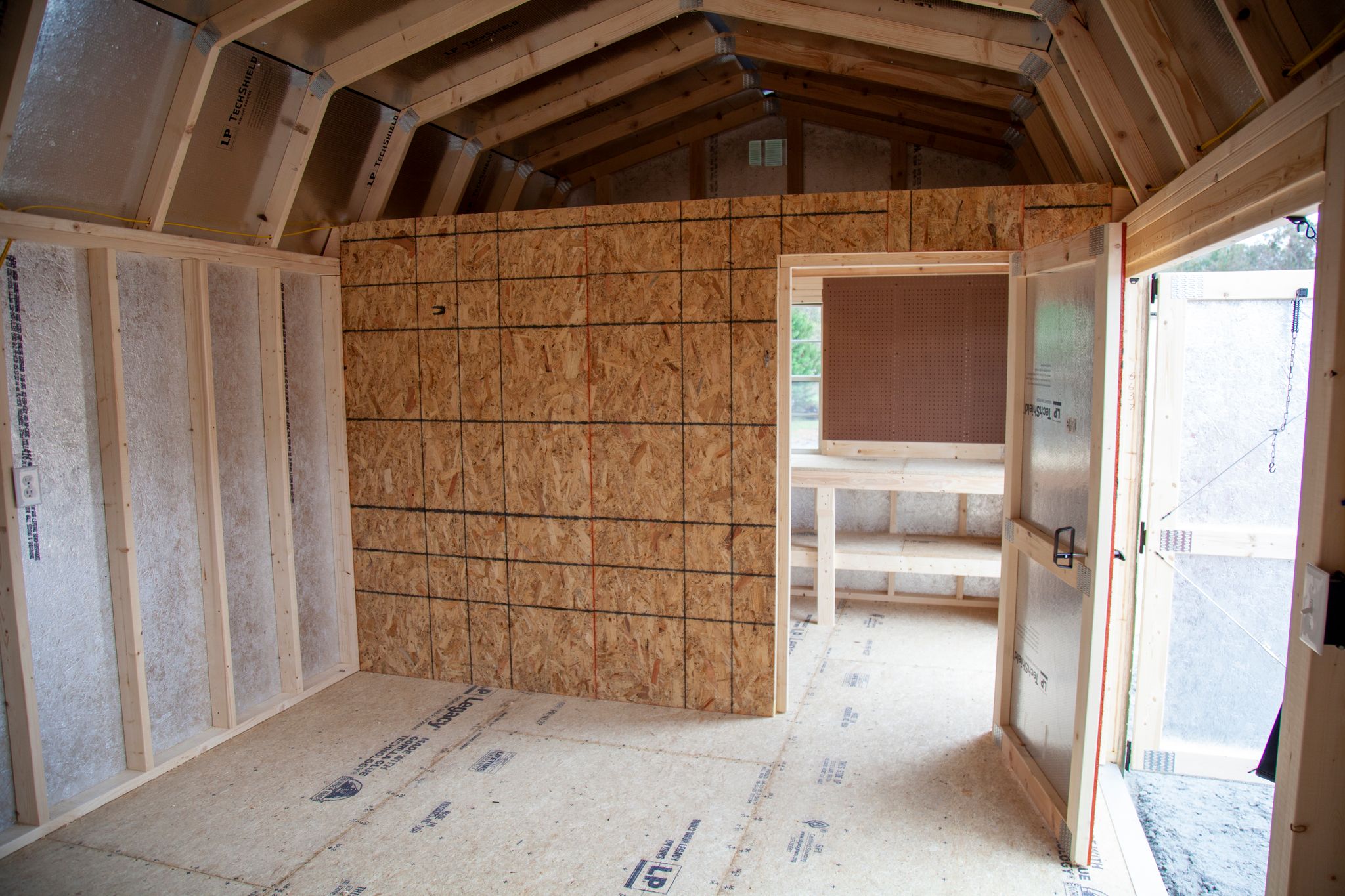 The interior of a Westwood shed. Westwood's Handyman Package adds an additional interior wall and door to maximize storage.