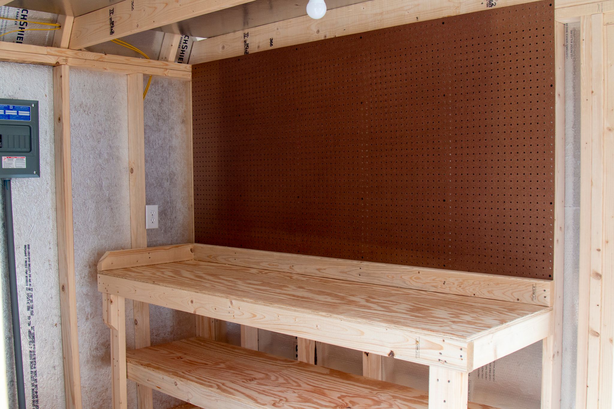 Westwood's Handyman Package includes a 6' workbench and pegboard for additional workshop capabilities.
