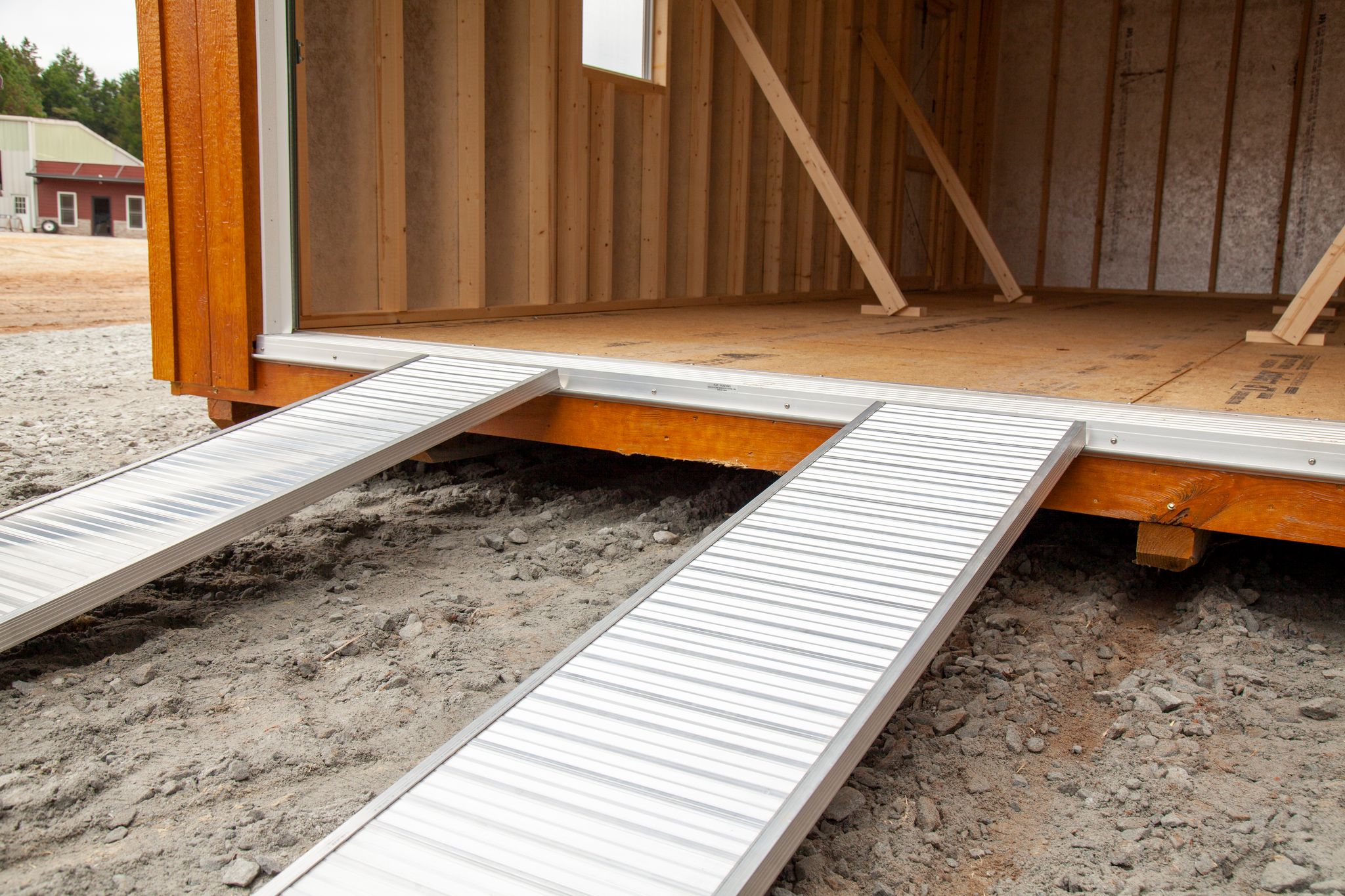 A ramp leading into an outdoor building for a shed or workshop.